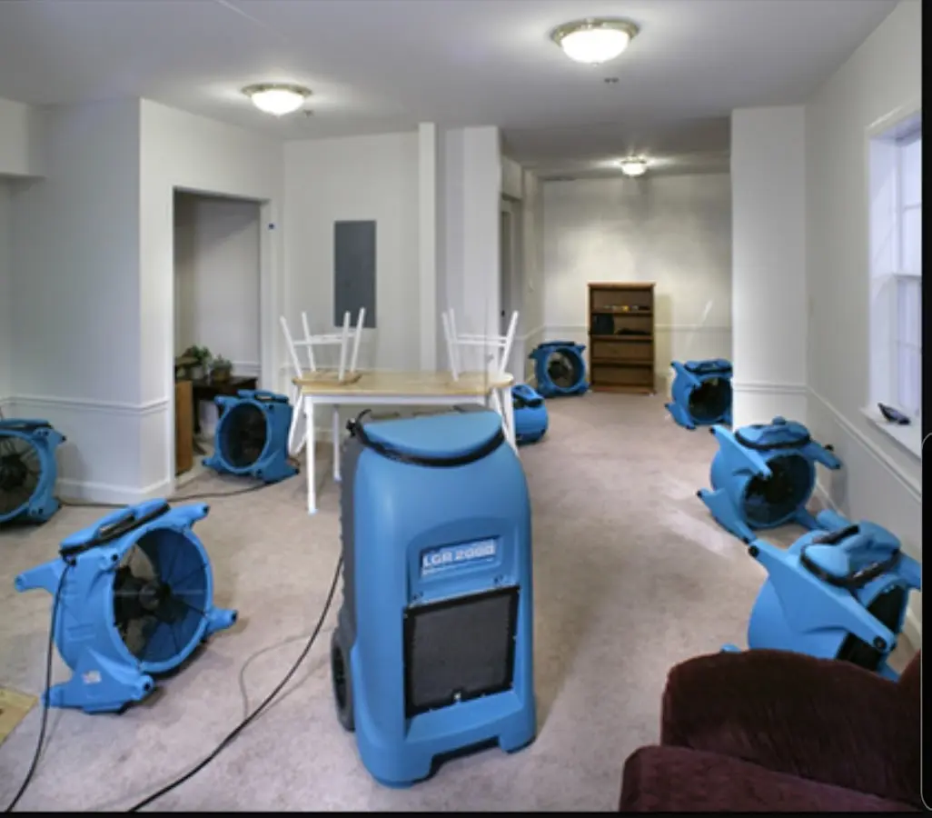 Air movers and dehumidifier setup for Water Damage Restoration in Decorah